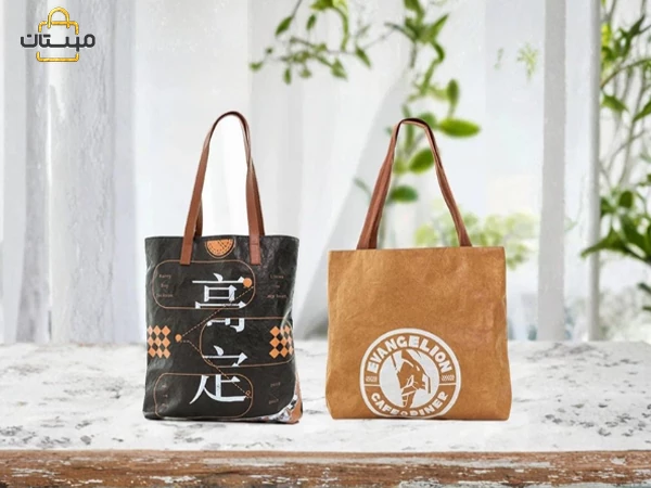 بررسی ۵ عامل اصلی که بر قیمت ساک دستی کاغذی و پارچه‌ای تأثیر می‌گذارند، از جمله نوع مواد، ابعاد، چاپ، تعداد سفارش و طراحی سفارشی